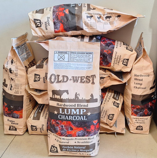 Old West charcoal bags stacked for distribution